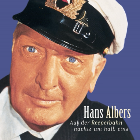 Albumcover Hans Albers – Nimm uns mit Kapitän auf die Reise! Portrait Hans Albers mit Kapitänsmütze, hintergrund blau